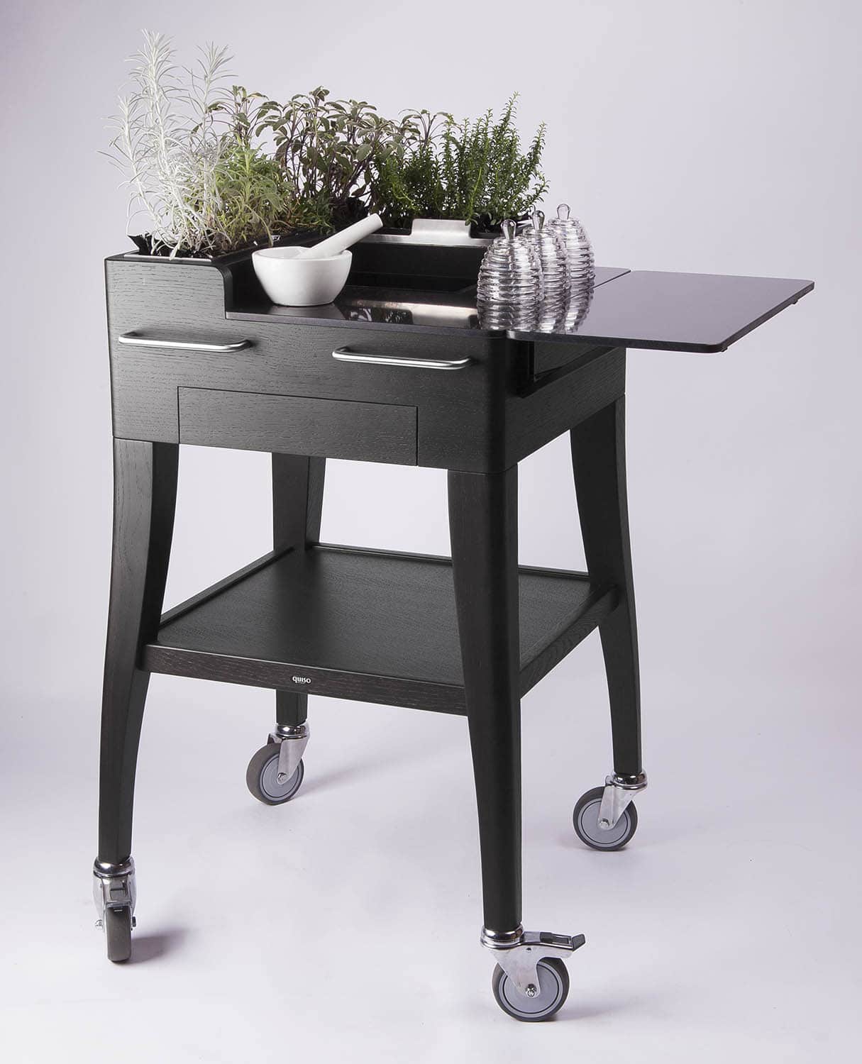 Tea and infusion trolley for fresh herbs, Jardin des infusions by QUISO in black oak, top and flap in black Quartz stone with integrated mortar and honey pots